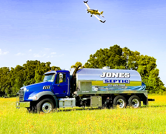 Jones septic truck in a field